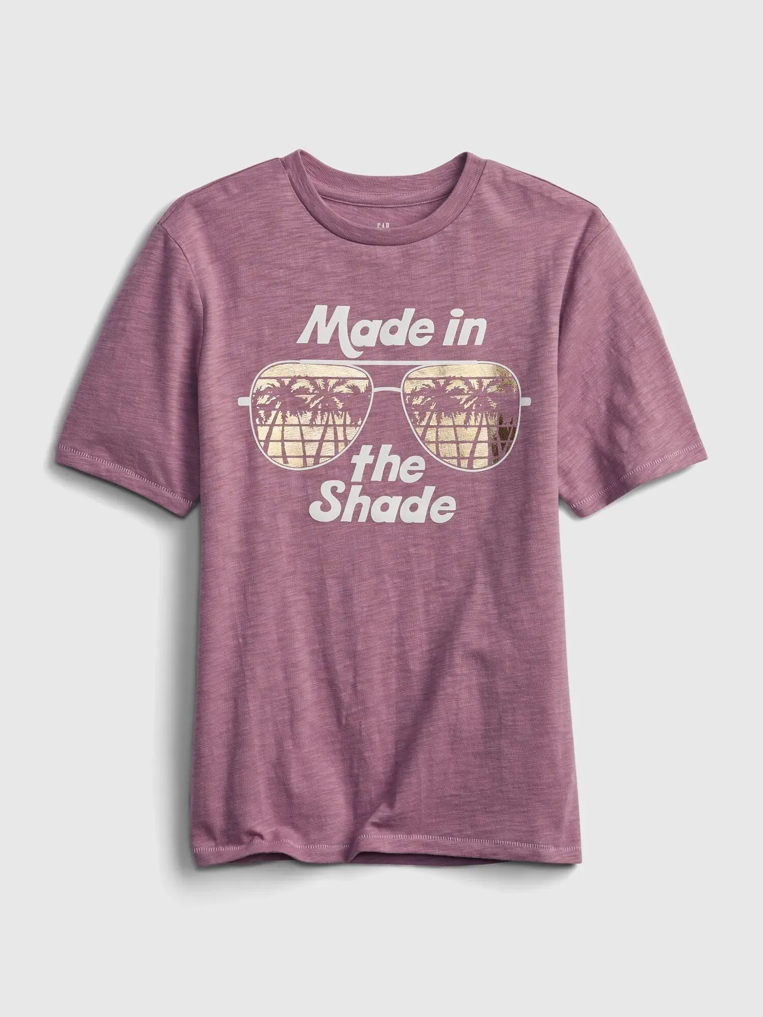 Faded red tshirt with an image of sunglasses and the phrase 'Made in the Shade' printed on to it