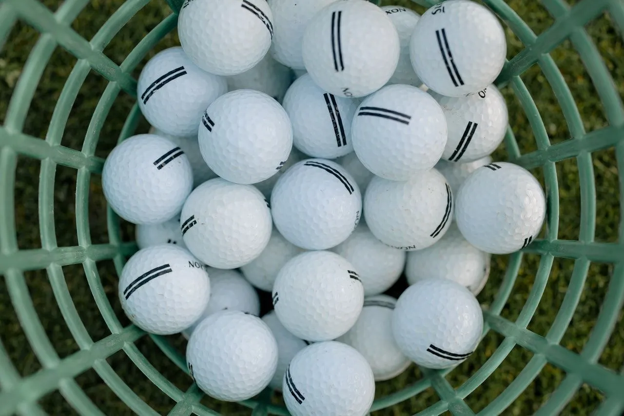 Manufacturers must make sure that the dimples on a golf ball are symmetrically arranged.