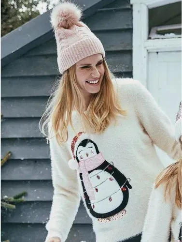 Woman wearing penguin Christmas jumper