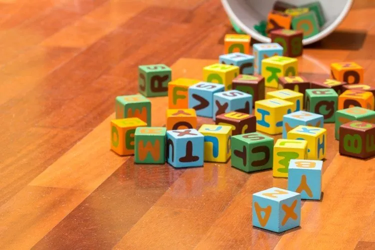 Colorful blocks of alphabets scattered on floor
