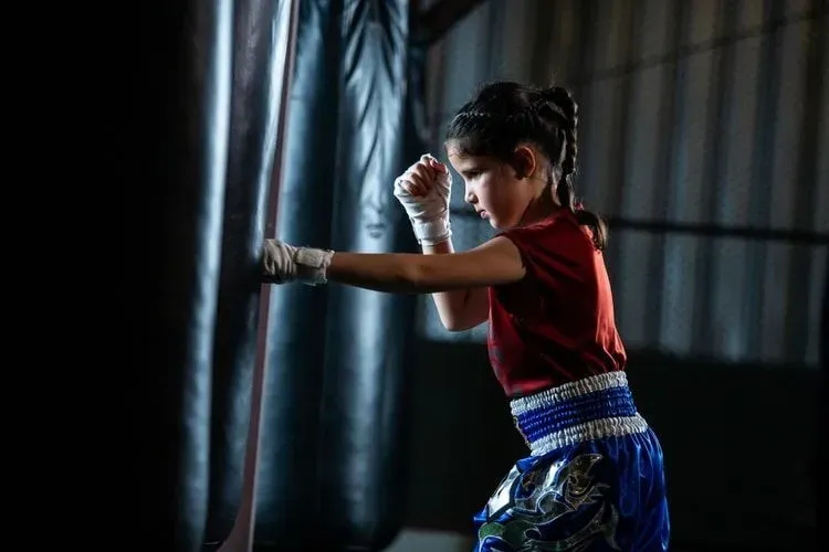 Little girl Thai boxing training is a self defense course, Muay Thai.