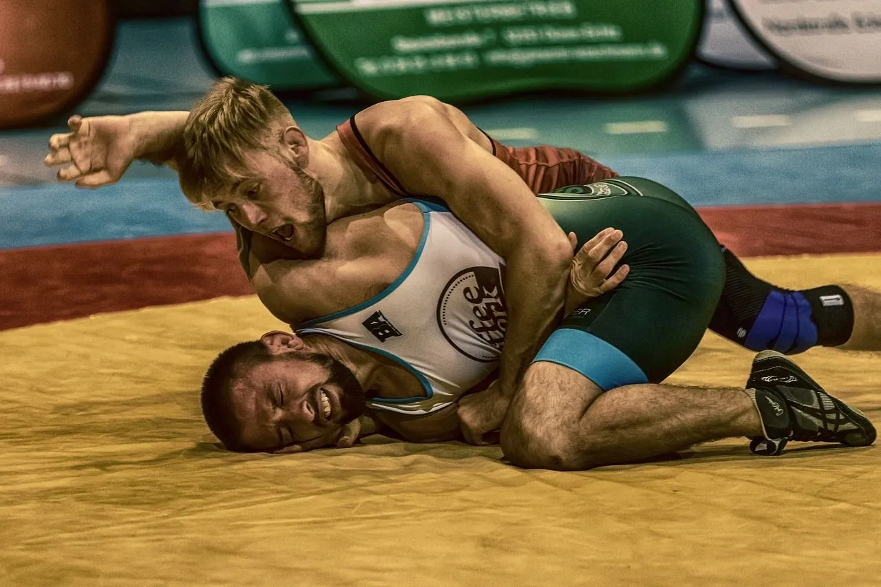 Wrestling involves pinning down the opponent on the floor while following the right techniques and rules of the game.