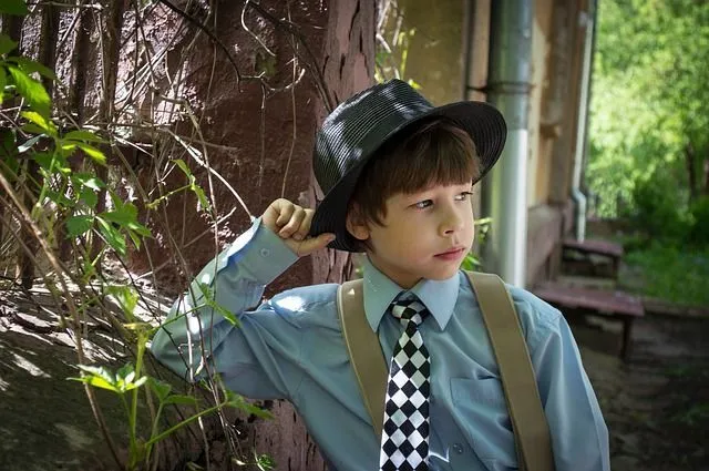 A little boy wearing a classic outfit