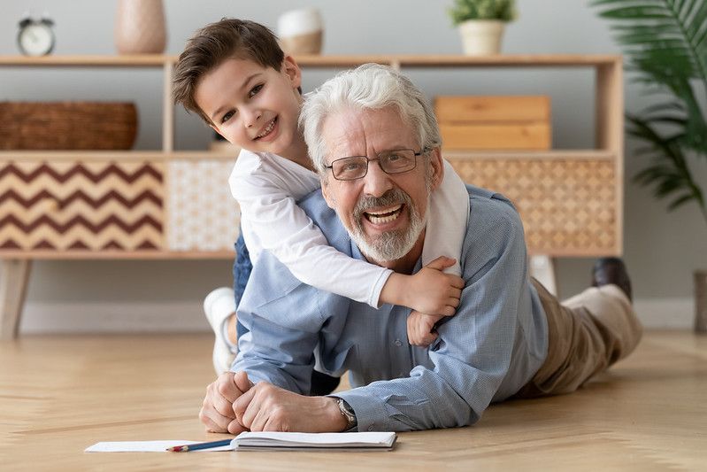 old grandfather and cute little boy grandson drawing with pencils - Nicknames