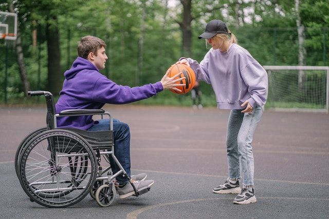 "A Couple Playing Basketball - International Day Of Acceptance "