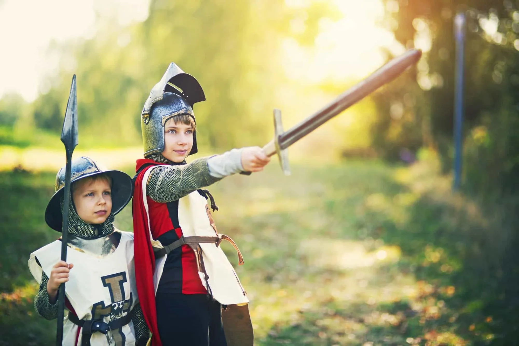 Two children dressed up as knights.
