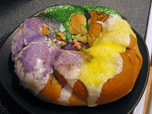 King cake facts state that the cake is eaten on Epiphany when three kings visit baby Jesus.