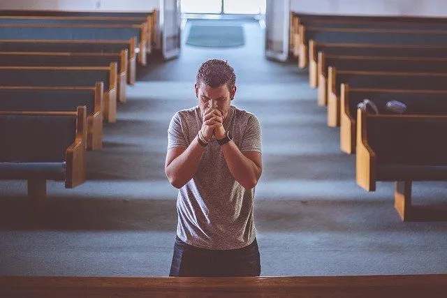 Say a prayer in a church.