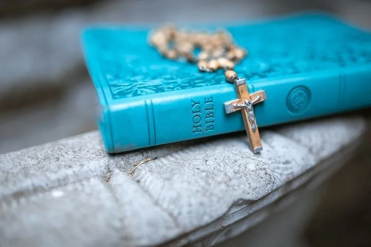 Blue Holy Bible with rosary