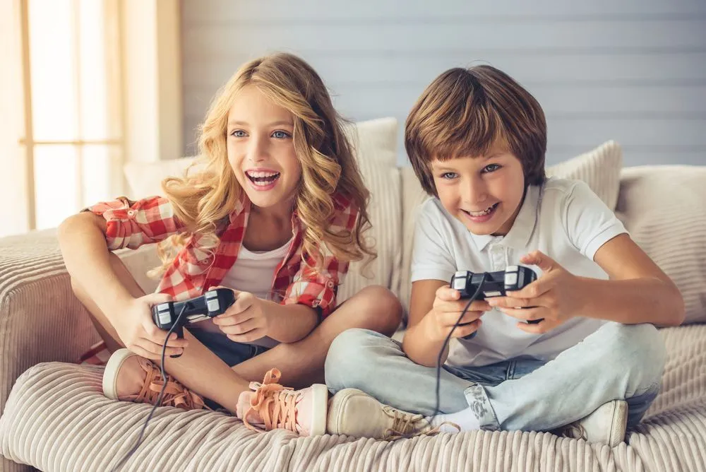 Girl and boy playing video games