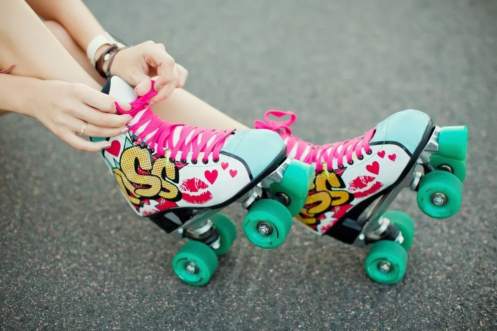 A girl wearing graffiti style roller derby