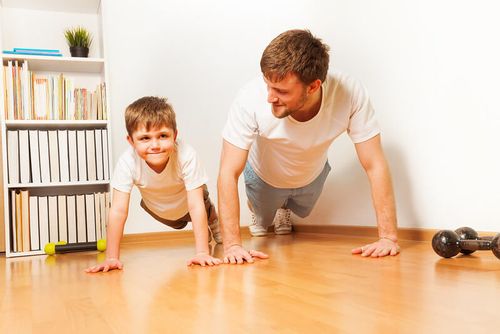 Father and son getting ready to do a home workout.