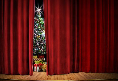 Christmas tree behind a curtain