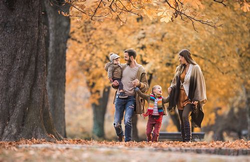 Family spending time in the forest in autumn