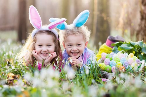 Two little girls dressed as the Easter Bunny.