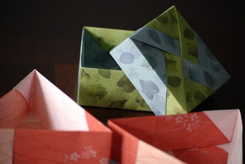 Origami gift boxes with their lids off.