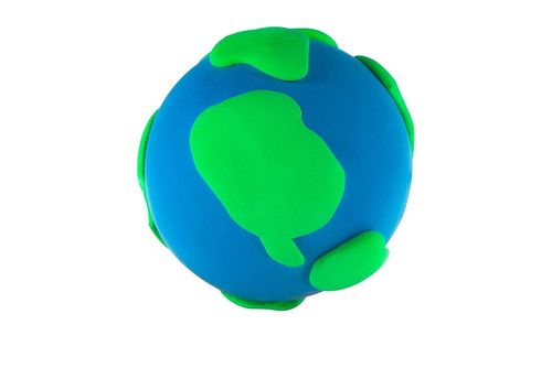 Plasticine model of planet Earth against a white background.