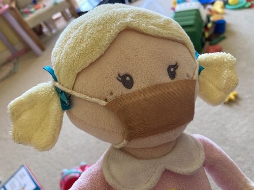 Esther toy wearing a homemade face mask.