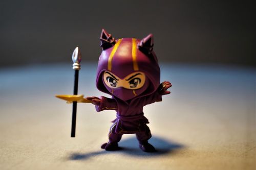 Cute figurine of a Ninja wearing a purple cape
