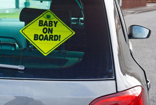 The baby on board is a safety sign and should be hung up by all parents who have children under the age of ten.