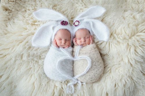 Two sleeping babies in the rabbit costume