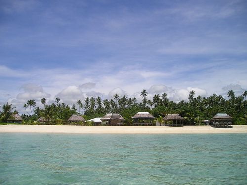 Beautiful blue landscape view of ocean and island houses in Samao, a Pacific island