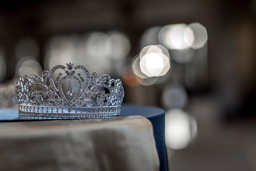 Close up shot of a jewel crown on table