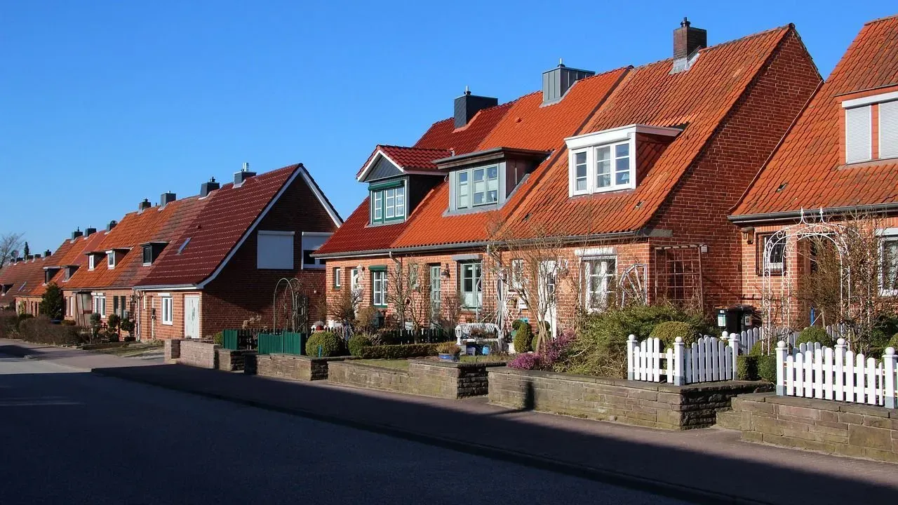 The front door of a brick house lends a unique character to the front elevation.