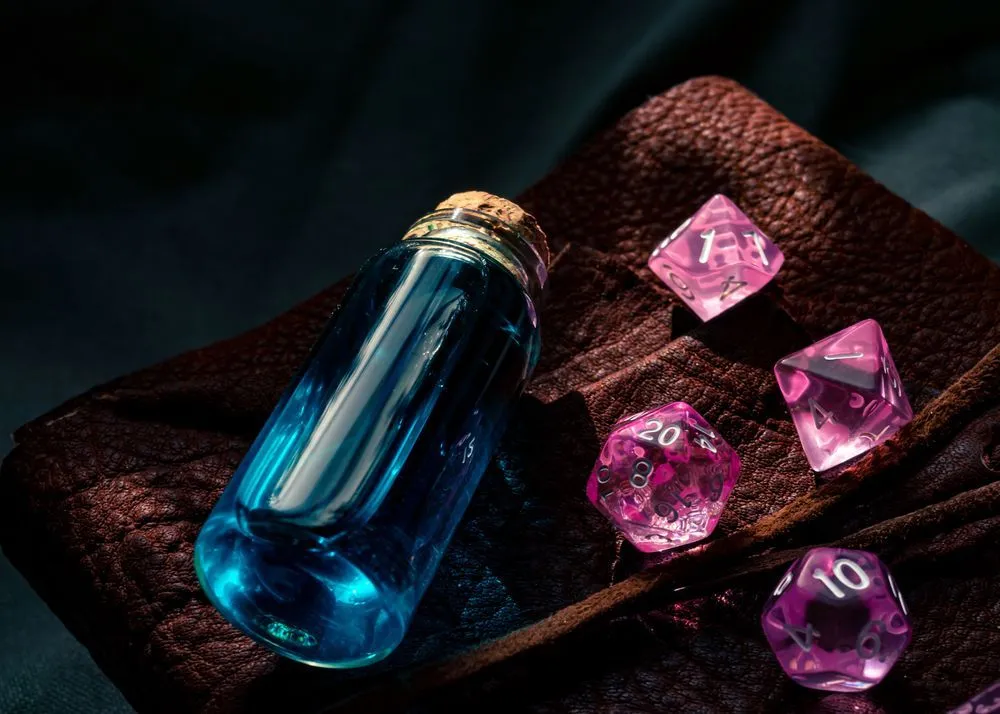 Pink d20 dice and blue magic potion from Dungeons and dragons